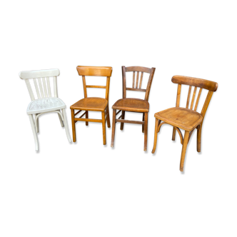 4 mismatched curved wooden bistro chairs