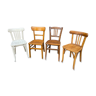 4 mismatched curved wooden bistro chairs