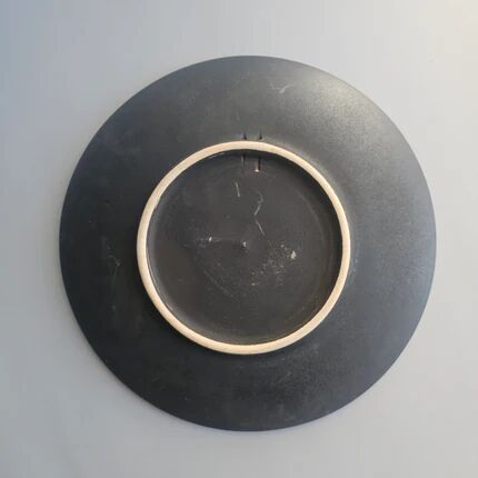 Black ceramic plate with wildflower design, Ruscha Art Pottery, Germany.