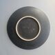 Black ceramic plate with wildflower design, Ruscha Art Pottery, Germany.