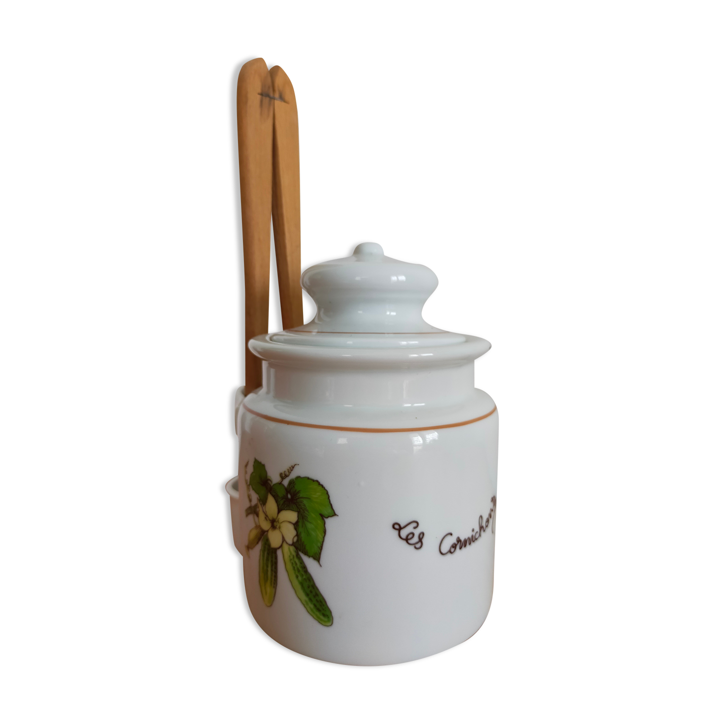 Vintage porcelain pickle pot with wooden pliers.