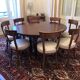 Mahogany round table in Louis Philippe style and 8 period chairs from the early 19th century.