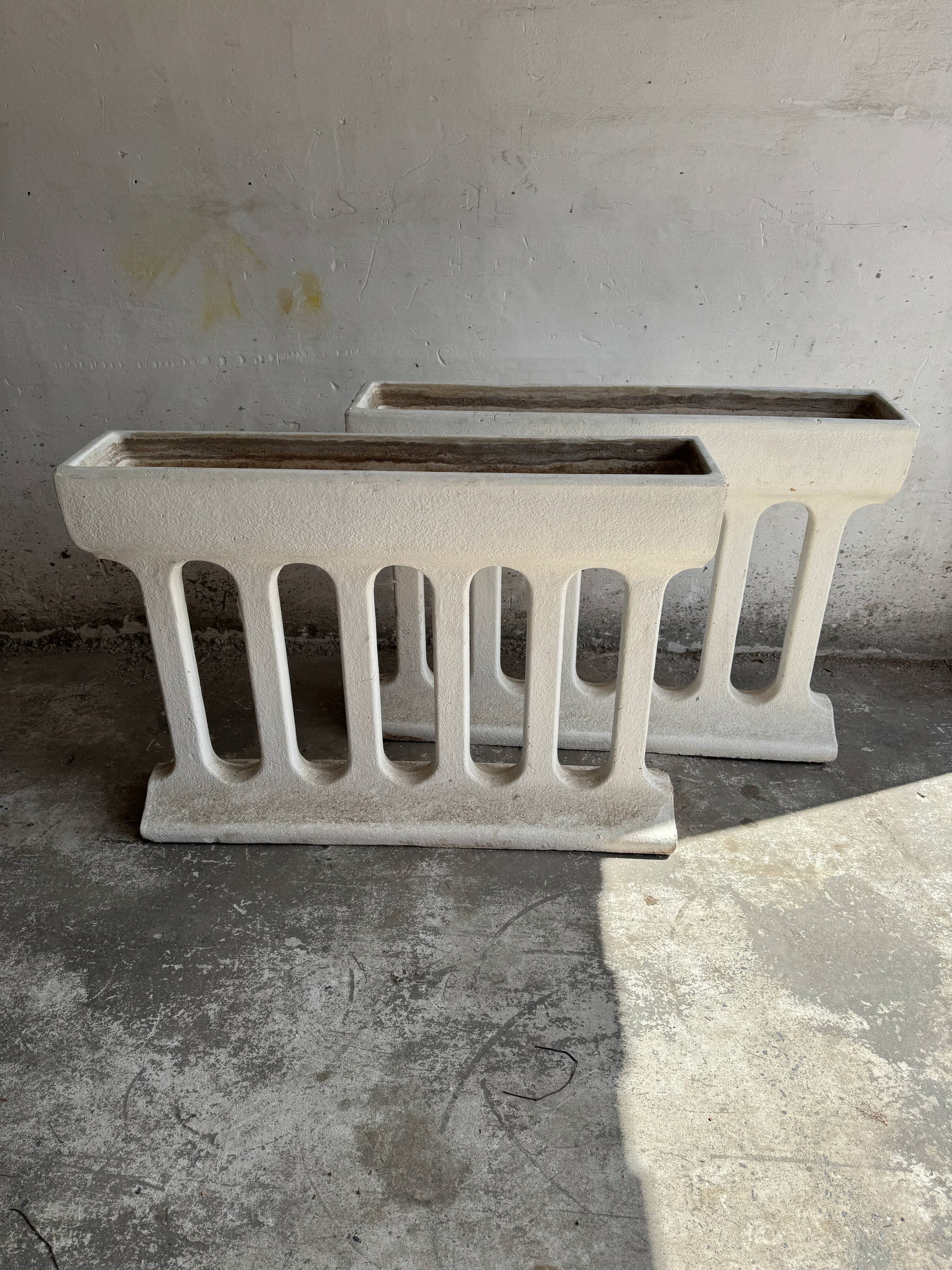 Pair of sculptural cast concrete planters in Off-White, mid-century brutalist style, long and rectangular.