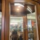 Wooden display case and half-moon mirror