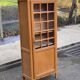 Armoire parisienne vitrée en bois clair 1960