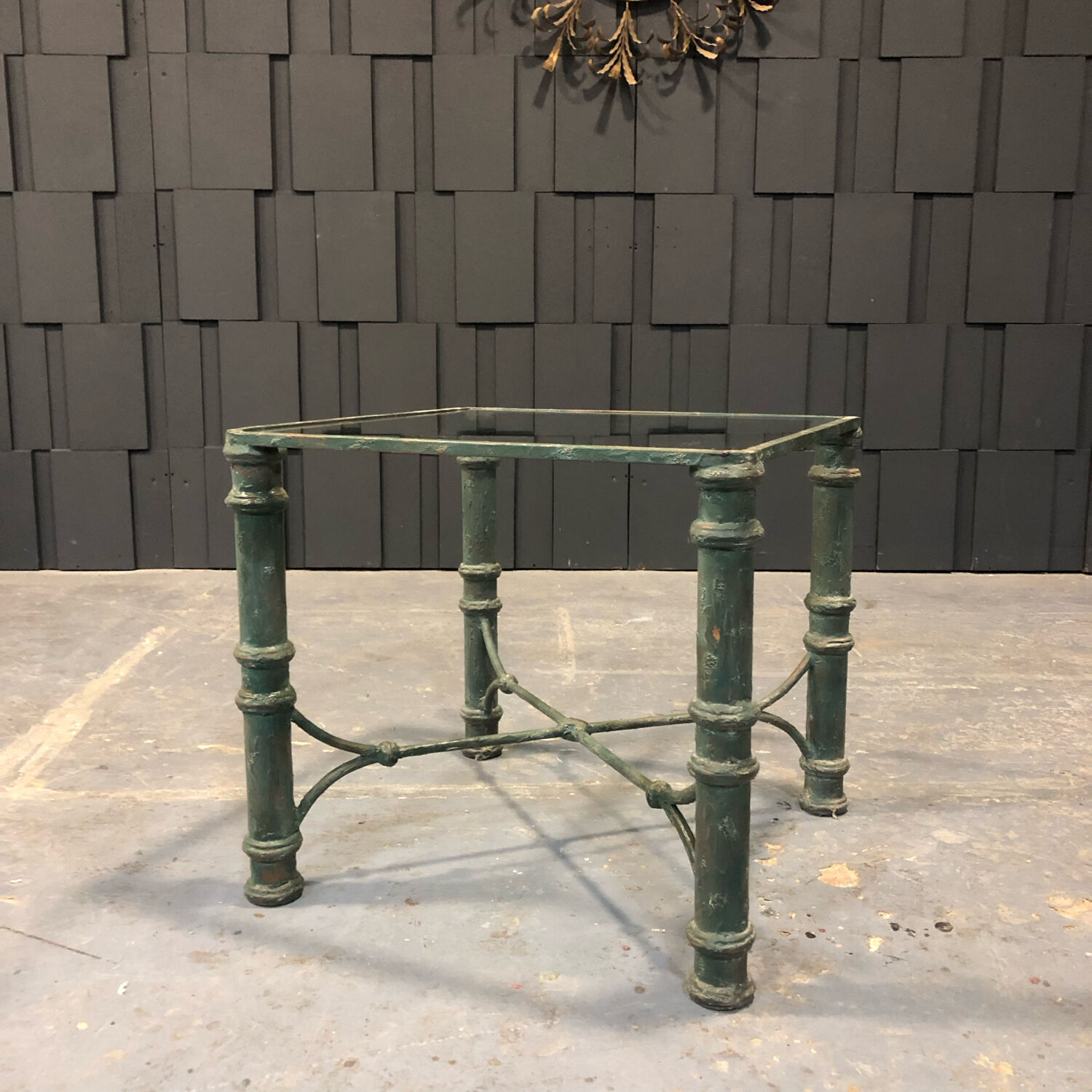 Iron and glass side table with antique patina