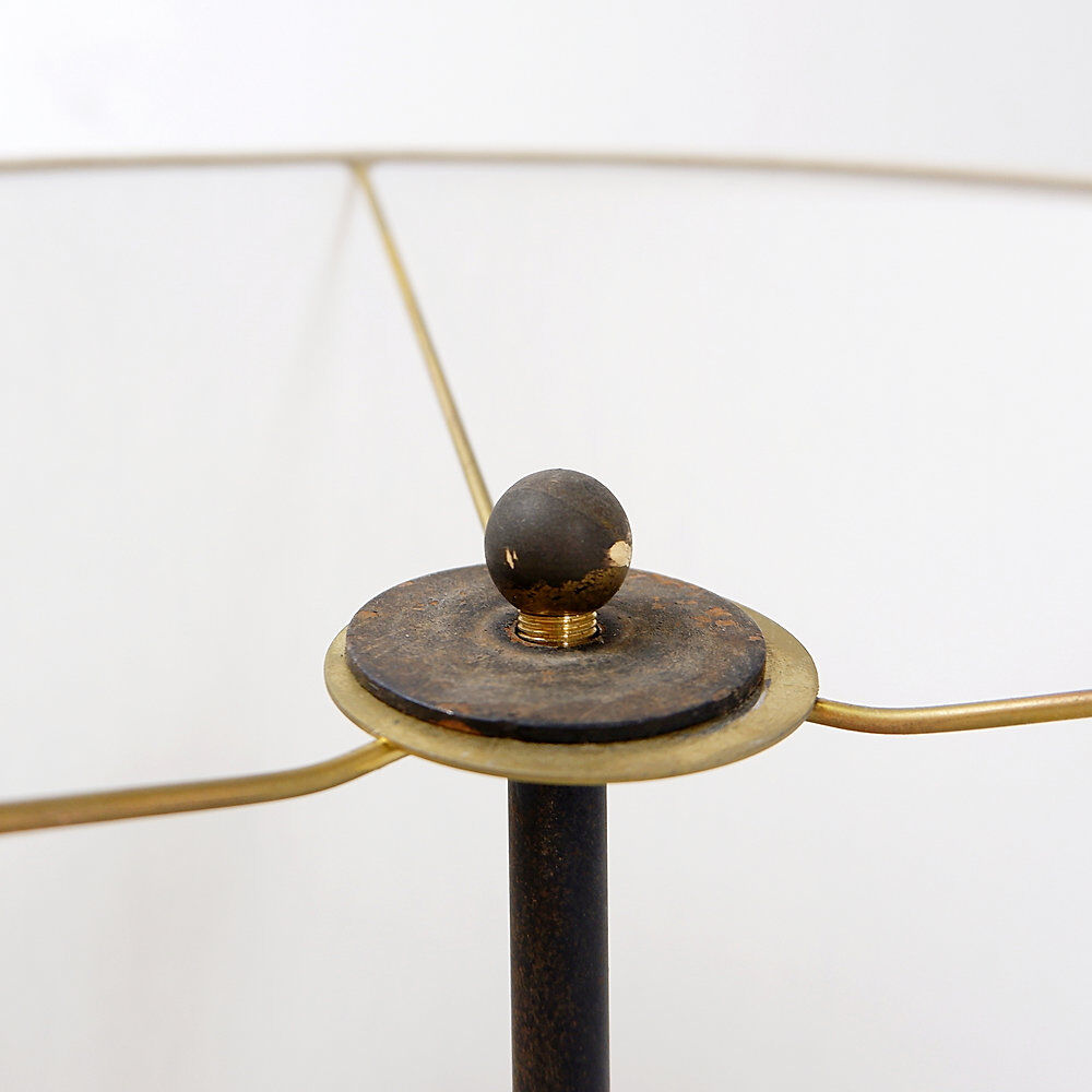 Tripod floor lamp in wrought iron and brass with bamboo-style base.