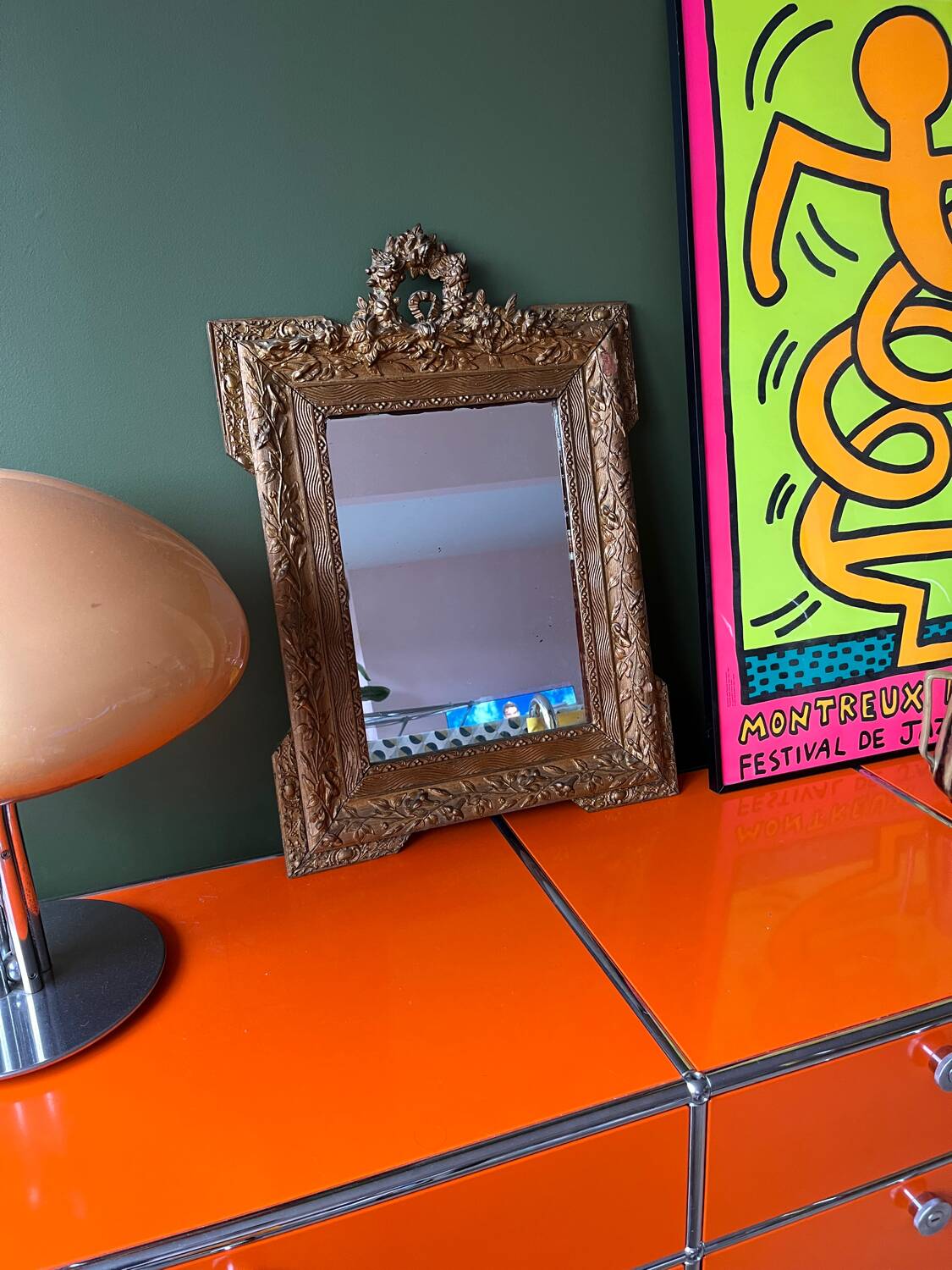 Golden trumeau mirror for fireplace, late 19th century, with sculpted pediment.