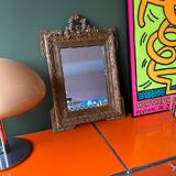 Golden trumeau mirror for fireplace, late 19th century, with sculpted pediment.