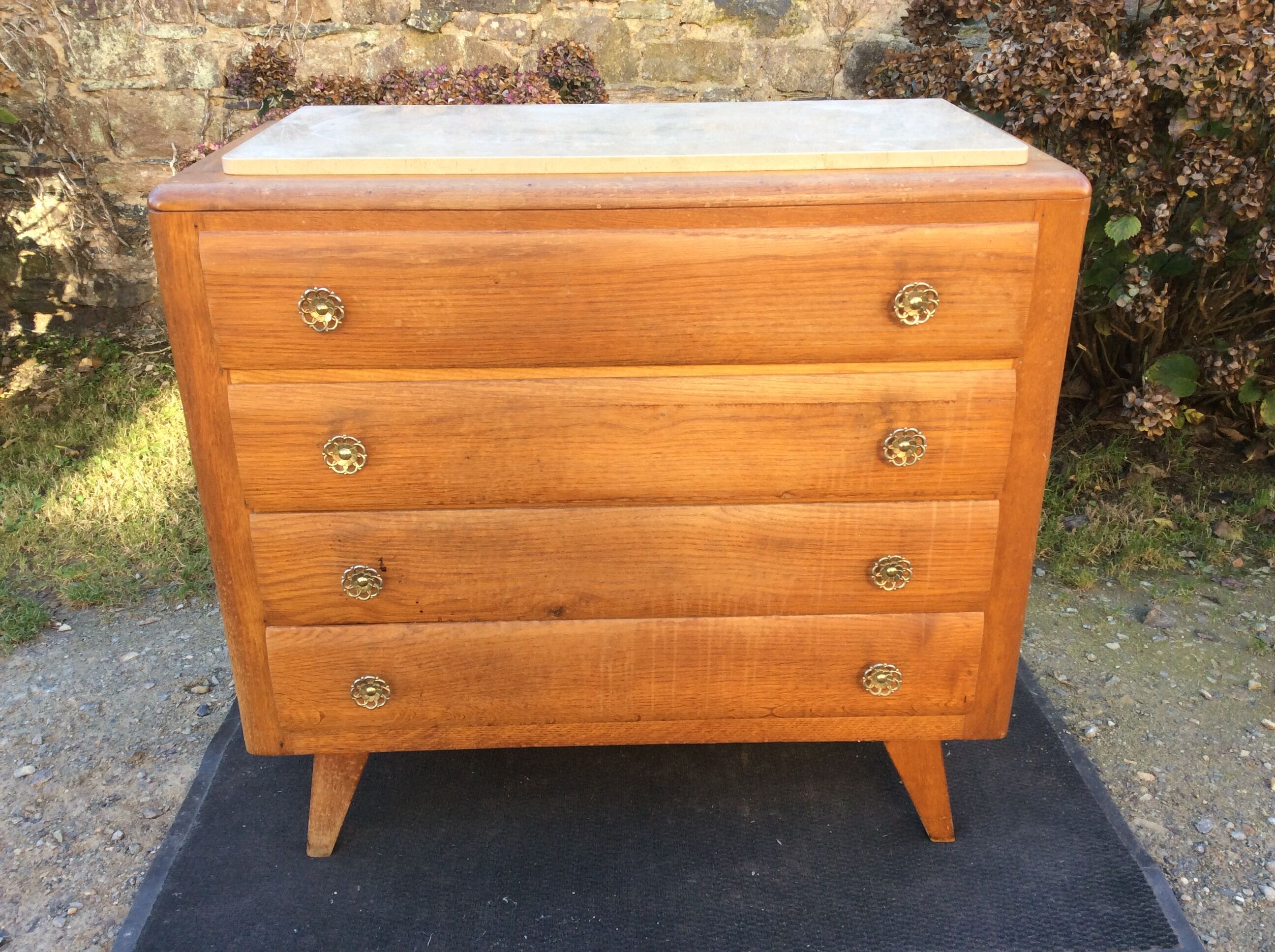 Vintage chest of drawers with oak compass base with marble top.