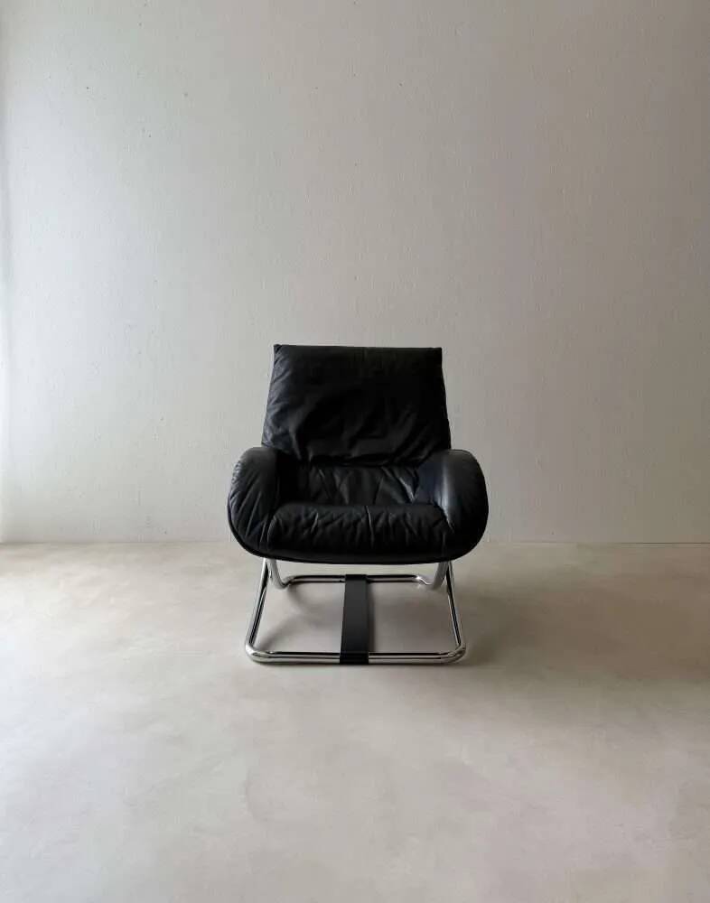 Swiss lounge chair with ottoman by Robert Haussmann from the 1980s.