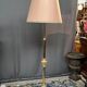 Baroque-style floor lamp in solid gilded bronze decorated with crystal pendants.