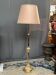 Baroque-style floor lamp in solid gilded bronze decorated with crystal pendants.