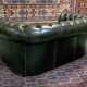 Chesterfield 2-seater green leather sofa from the 1980s