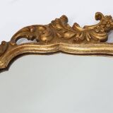Baroque style oval wall mirror in gilded wood, France