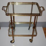 Serving golden skateboard in brass and glass