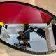 Bevelled oval mirror, richly crafted Art Deco wrought iron.