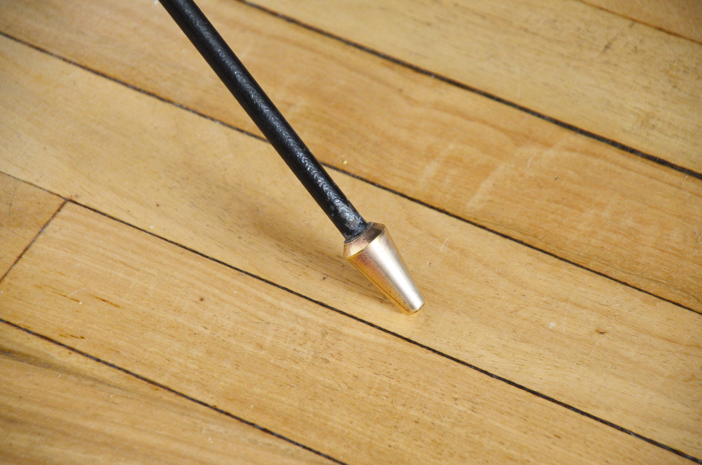 Black glass and brass coffee table in the 1960s