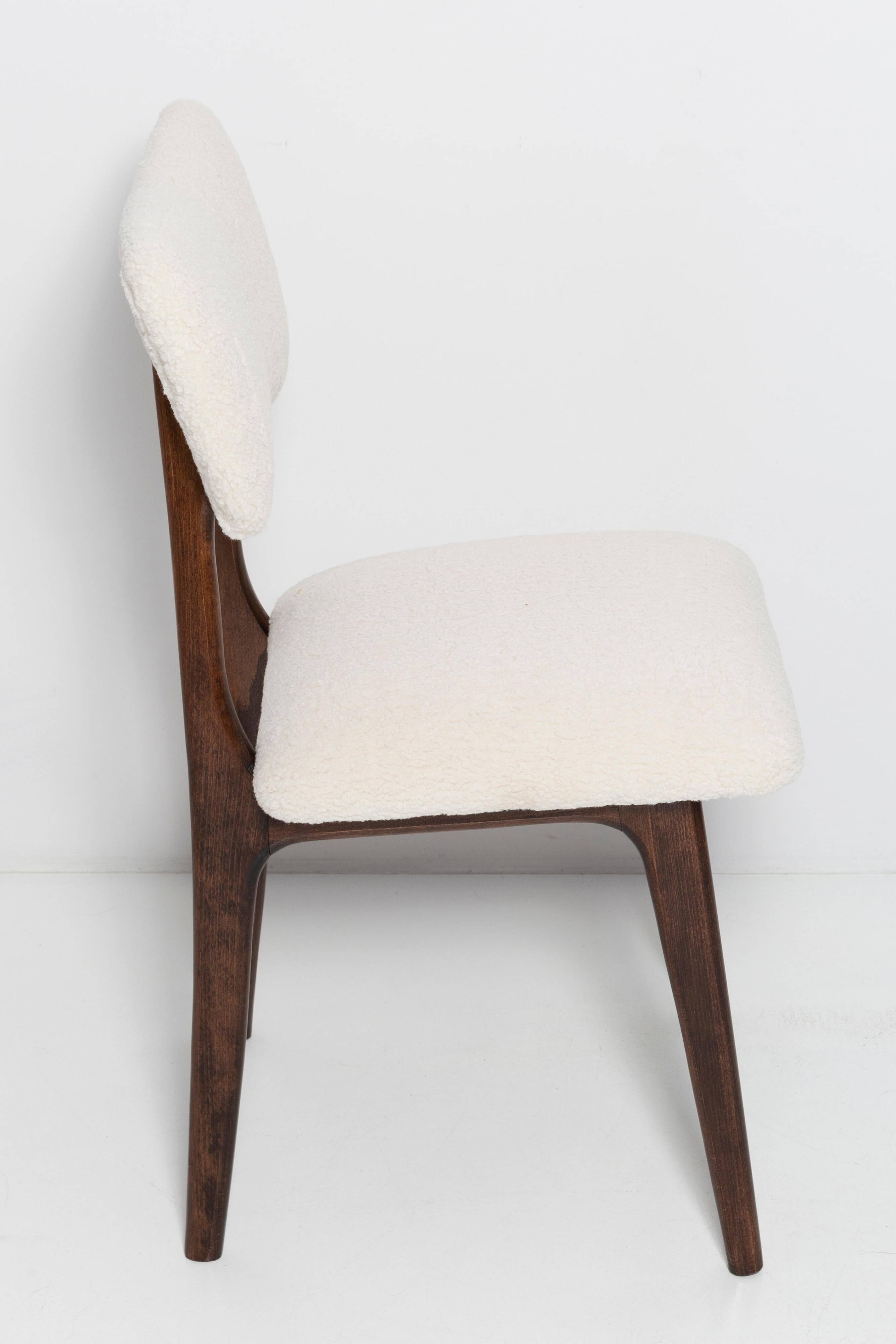 20th-century walnut and light cream boucle butterfly chair, Europe, 1960.