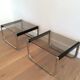 Pair of side tables in chrome, blackened wood and glass.