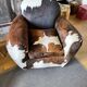 Fauteuils club en peau de vache