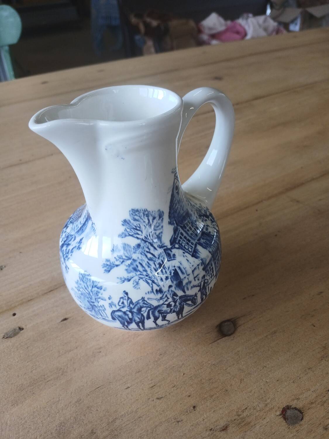 Small old pitcher in iron earth