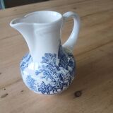 Small old pitcher in iron earth