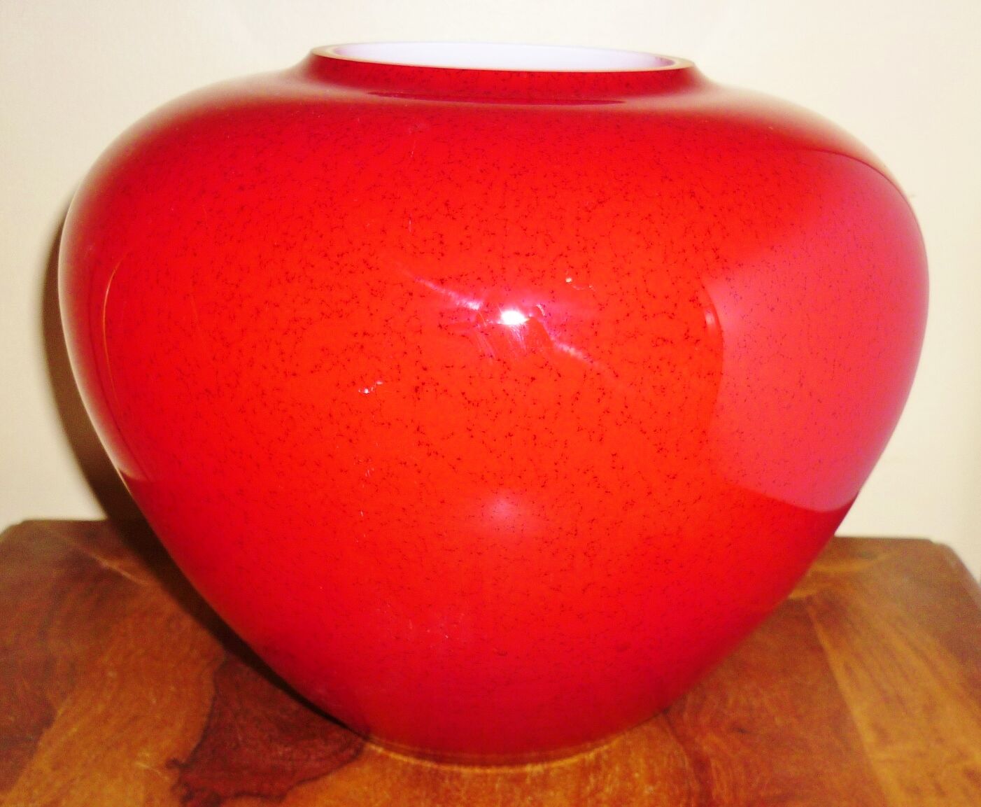 Pot-bellied, art deco vase in speckled ruby red multi-layered glass, white interior