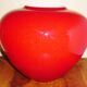 Pot-bellied, art deco vase in speckled ruby red multi-layered glass, white interior
