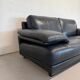 Two-seater Natuzzi sofa in navy blue leather.