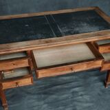 Antique wooden desk with upholstered top and 5 drawers