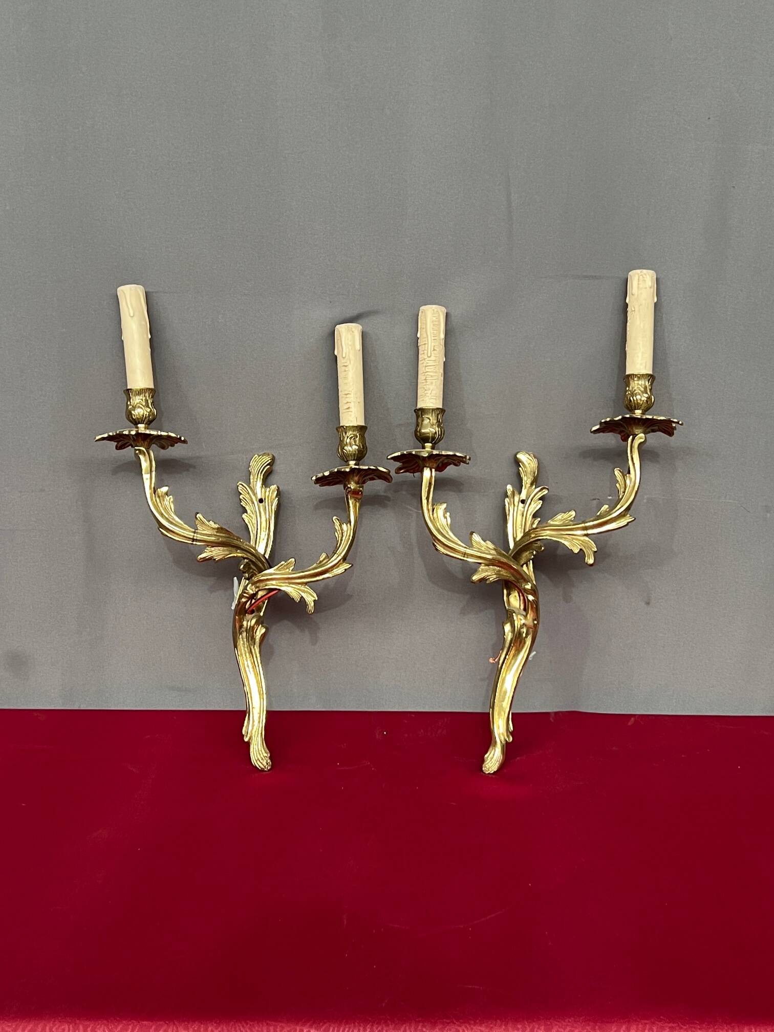 Pair of solid gilded bronze wall lights.