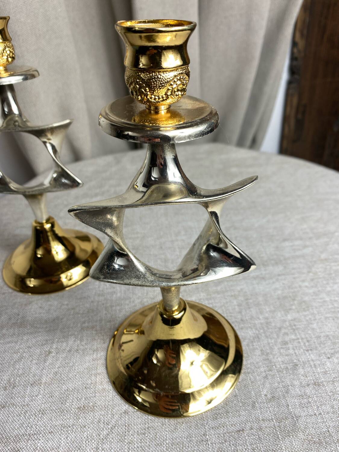 Pair of silver and gold metal candlesticks