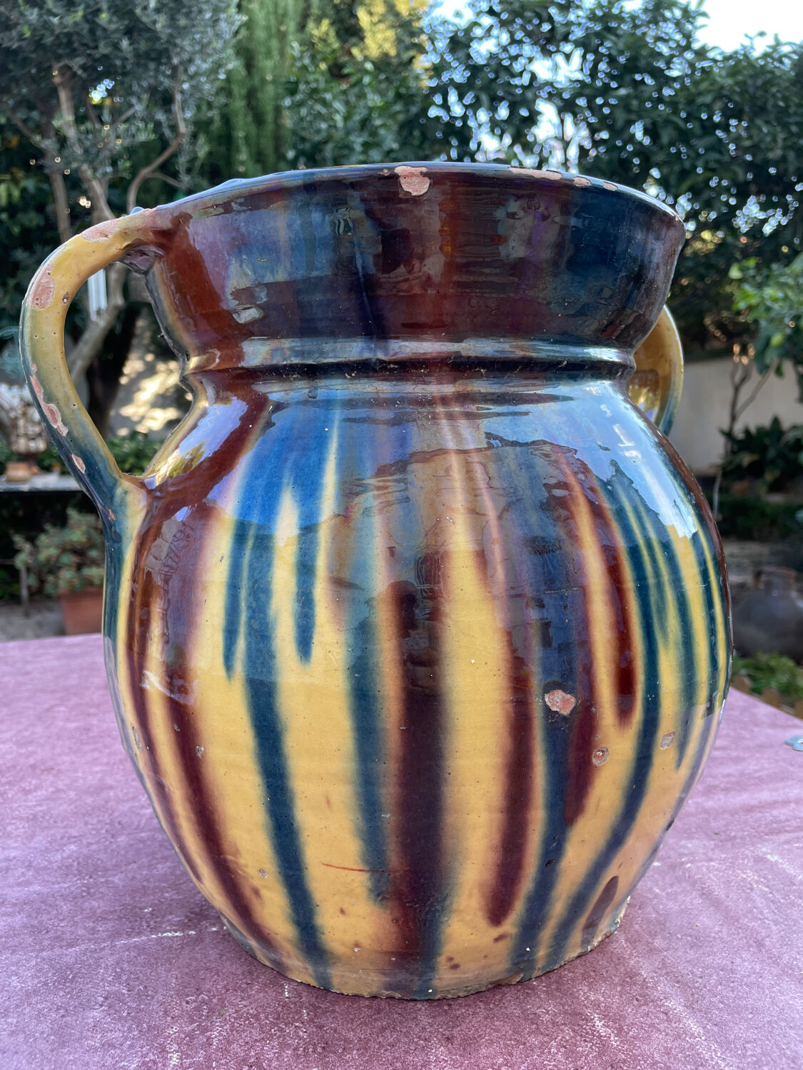 Old flower jar with two glazed earth handles