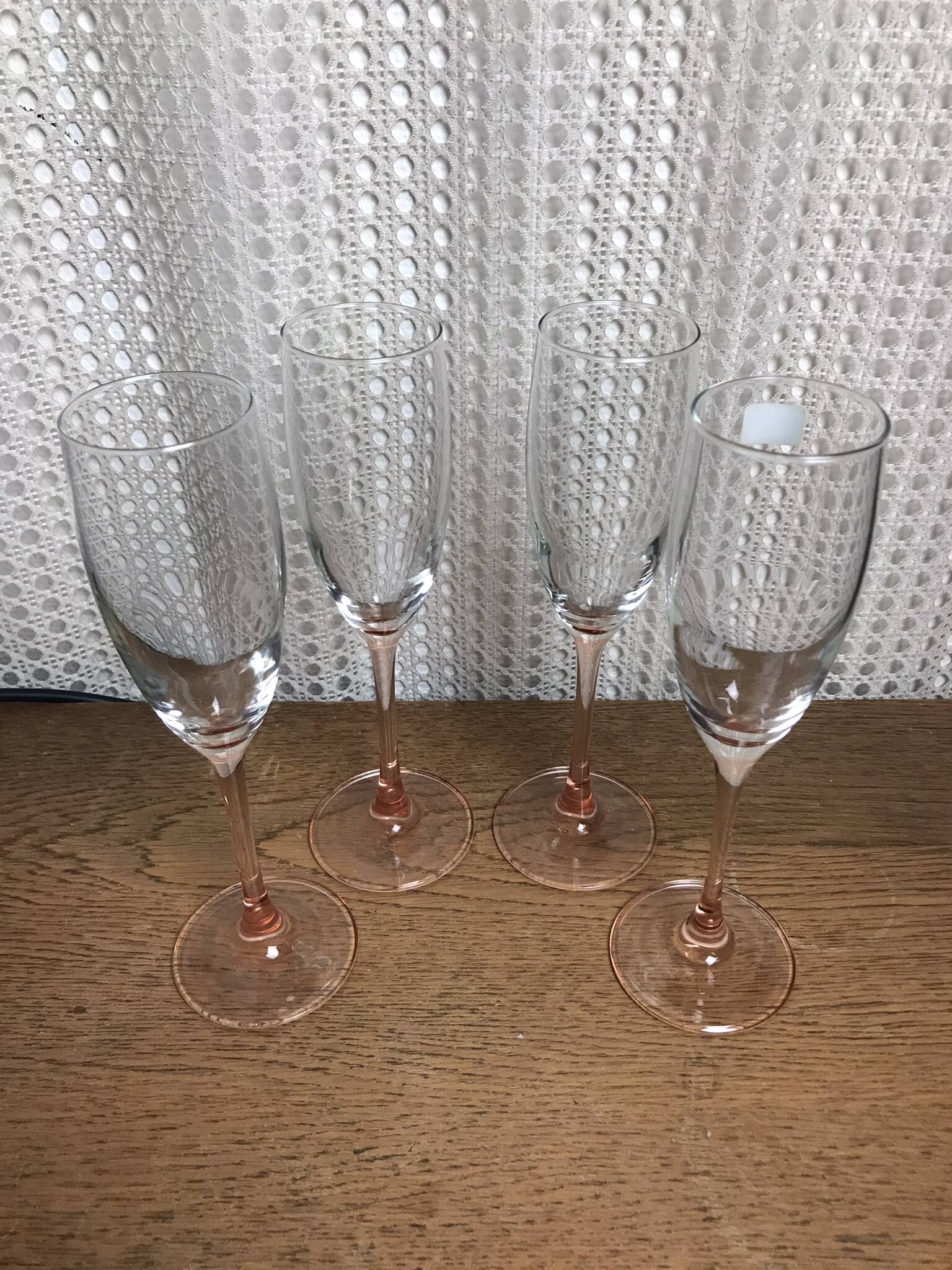 Set of 4 vintage Luminarc champagne flutes with pink stem