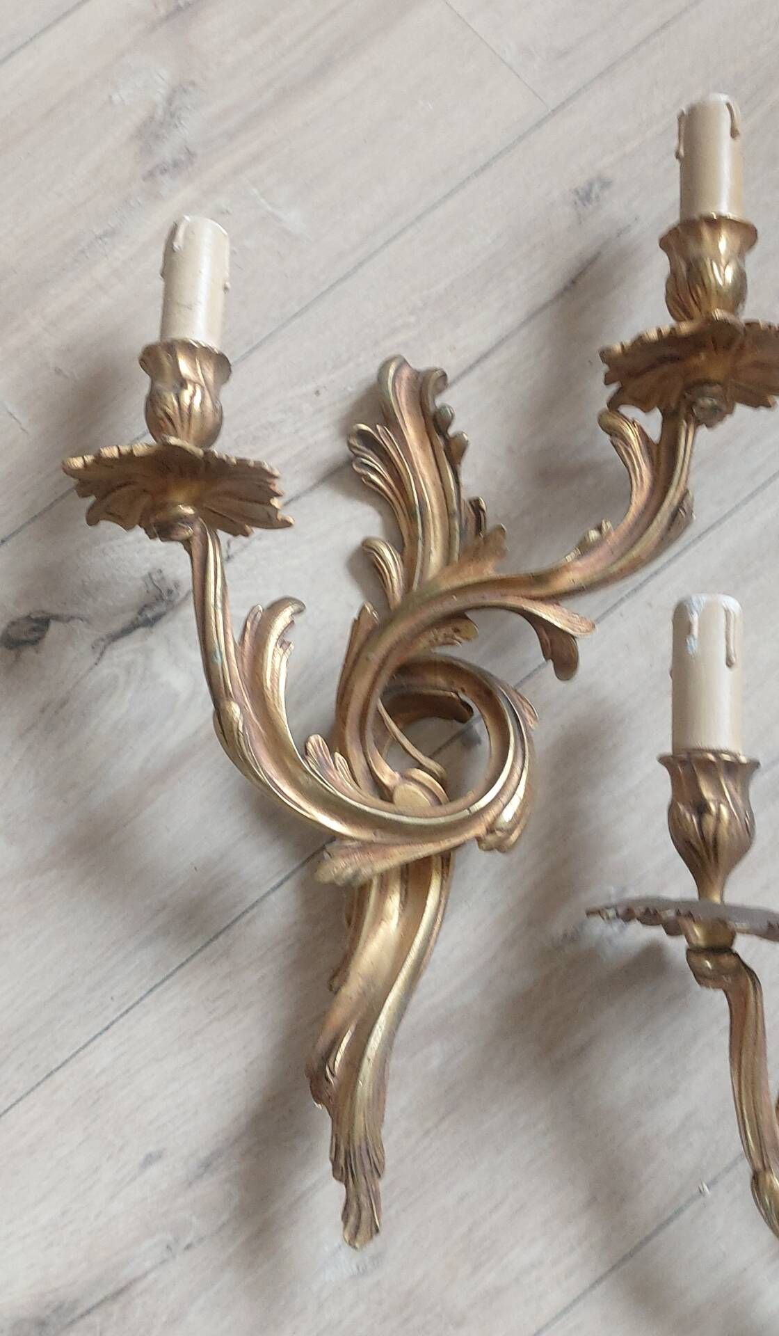Pair of original antique bronze wall sconces.
