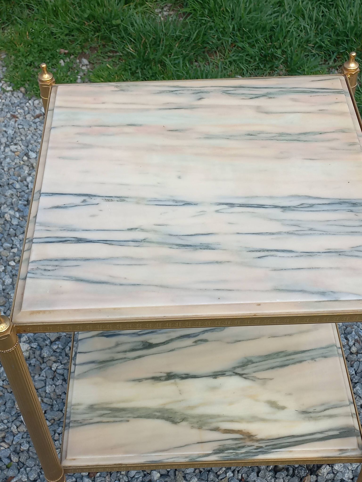 Pair of neoclassical side tables in bronze, brass, marble, and o.