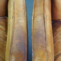 Set of English style light cognac colored leather armchairs.