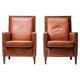 Pair of Art Deco armchairs in brown leather and teak, Netherlands, 1970s.