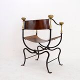 Curule armchair in wrought iron and leather