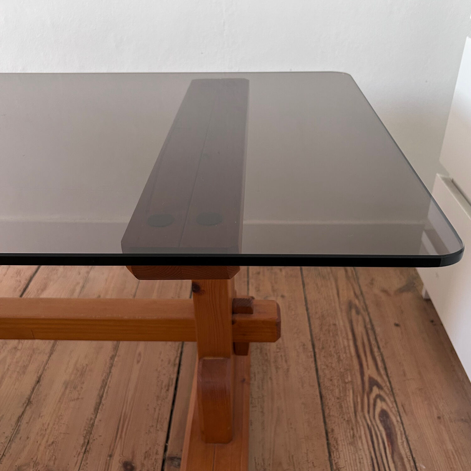 Pine coffee table with smoked glass top.