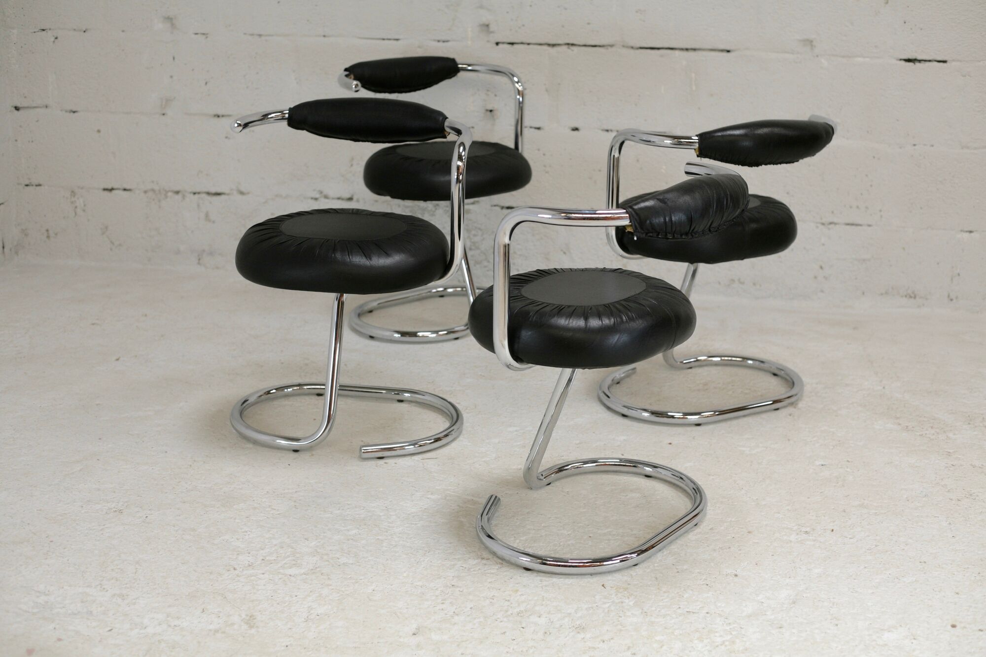 4 chairs tubular steel, imitation black leather, Italy, circa 1970