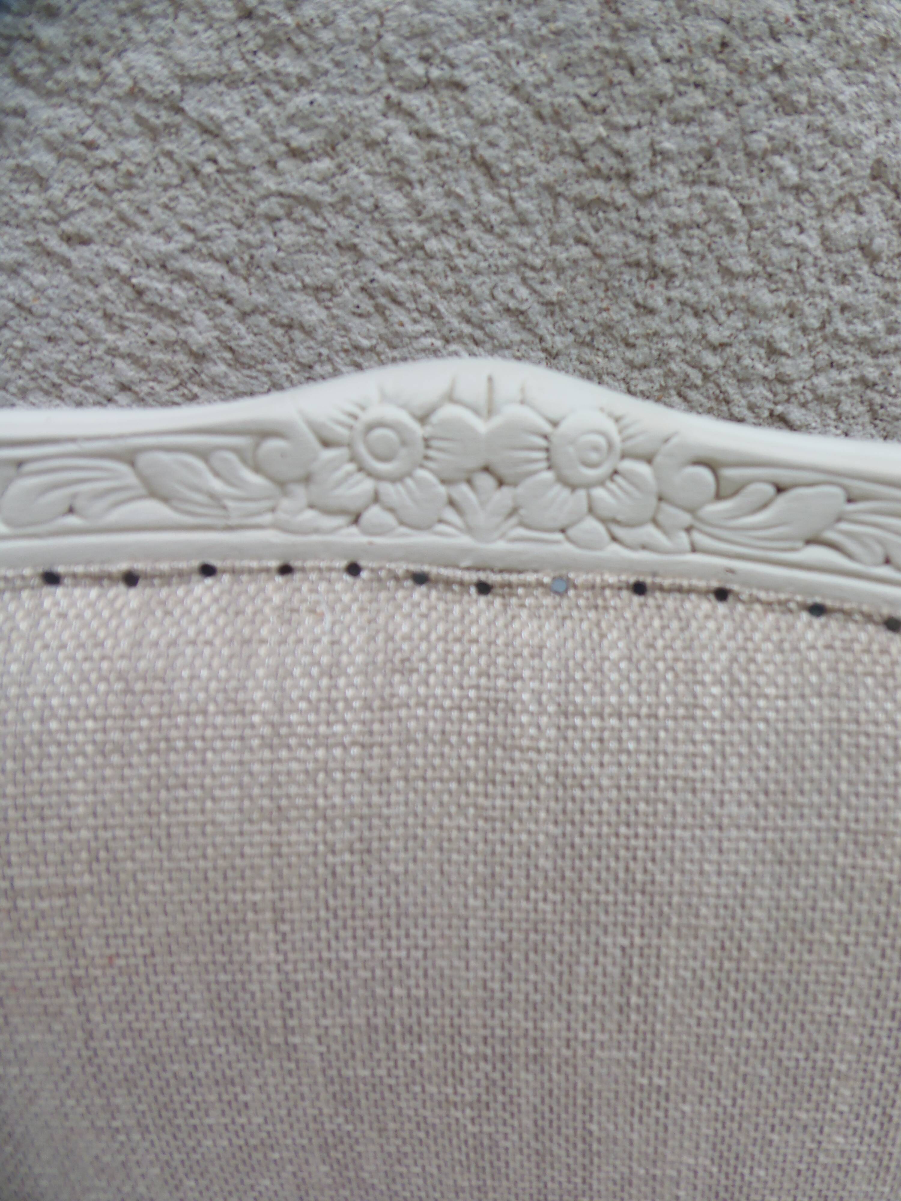 Louis XV style armchair in patinated beige, upholstered in beige fabric.