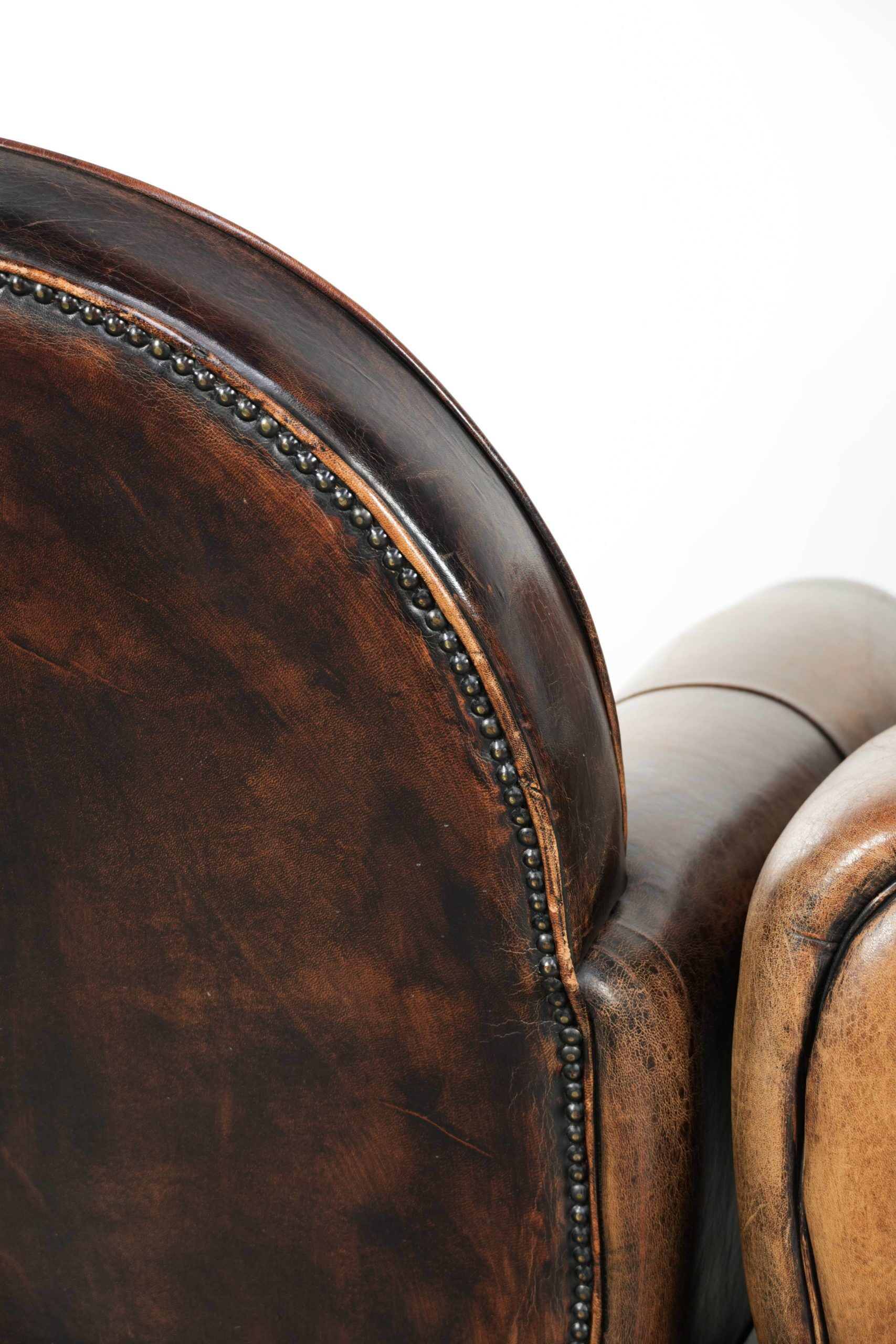 Set of two sheepskin Art Deco design armchairs with beautiful patina