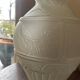 2 semi-opaque glass vases with relief bird designs.