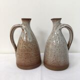 Duo of pitchers signed enamelled sandstone 1970