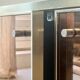 Low ivory lacquered enfilade, smoked mirror & brass JC Mahey, design 1970.