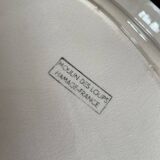 Oval plate Moulin des Loups in blue and red ceramic with a floral design.