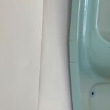 Baby blue plastic mirror and wash station