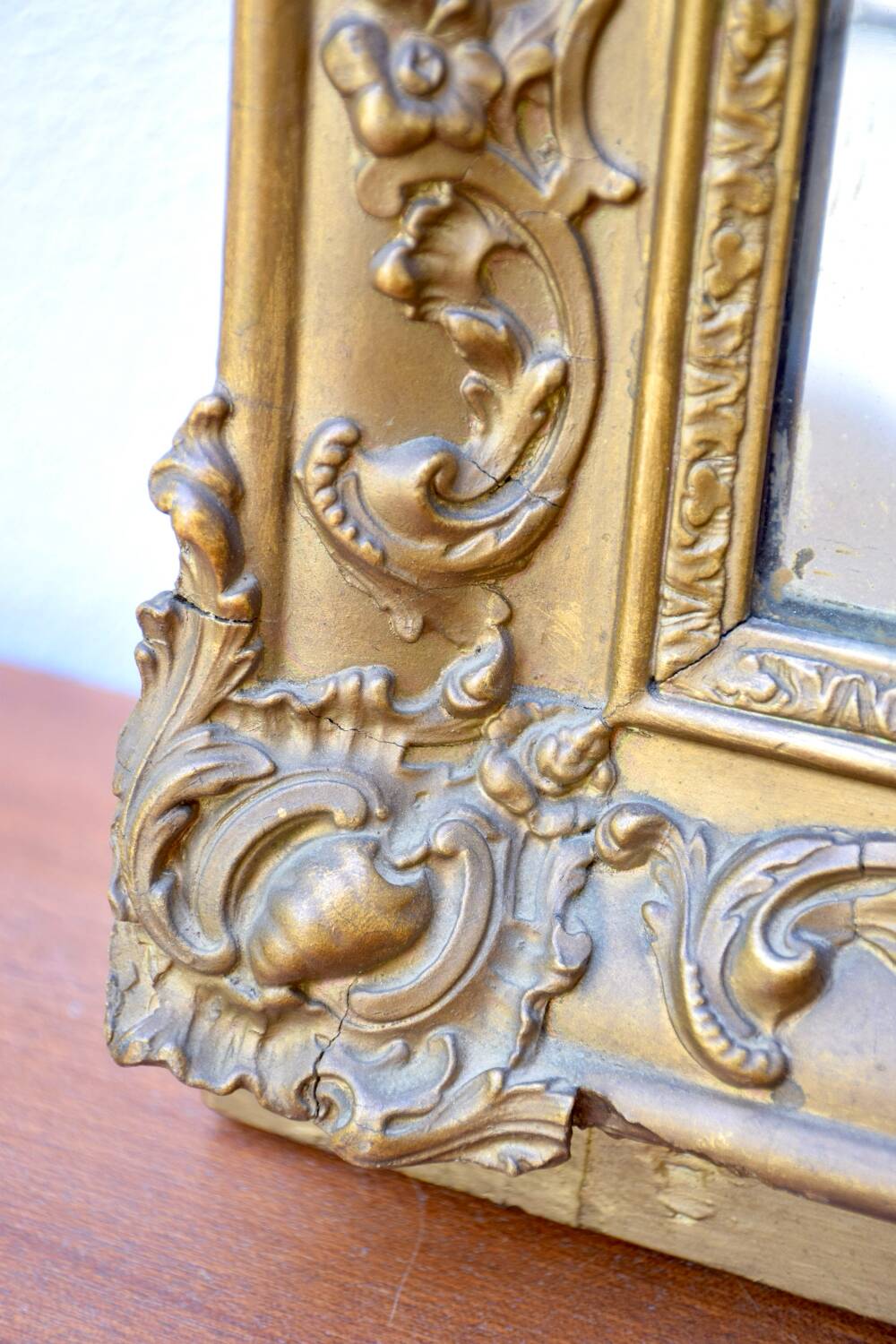 Antique mirror with gilded moldings